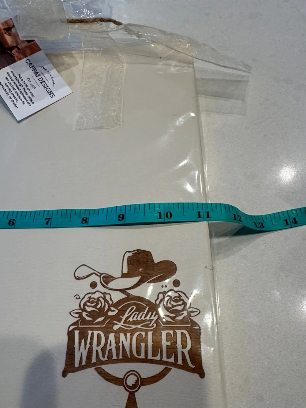Wrangler Lady wood serving piece in Cream with Brown Logo cappai design